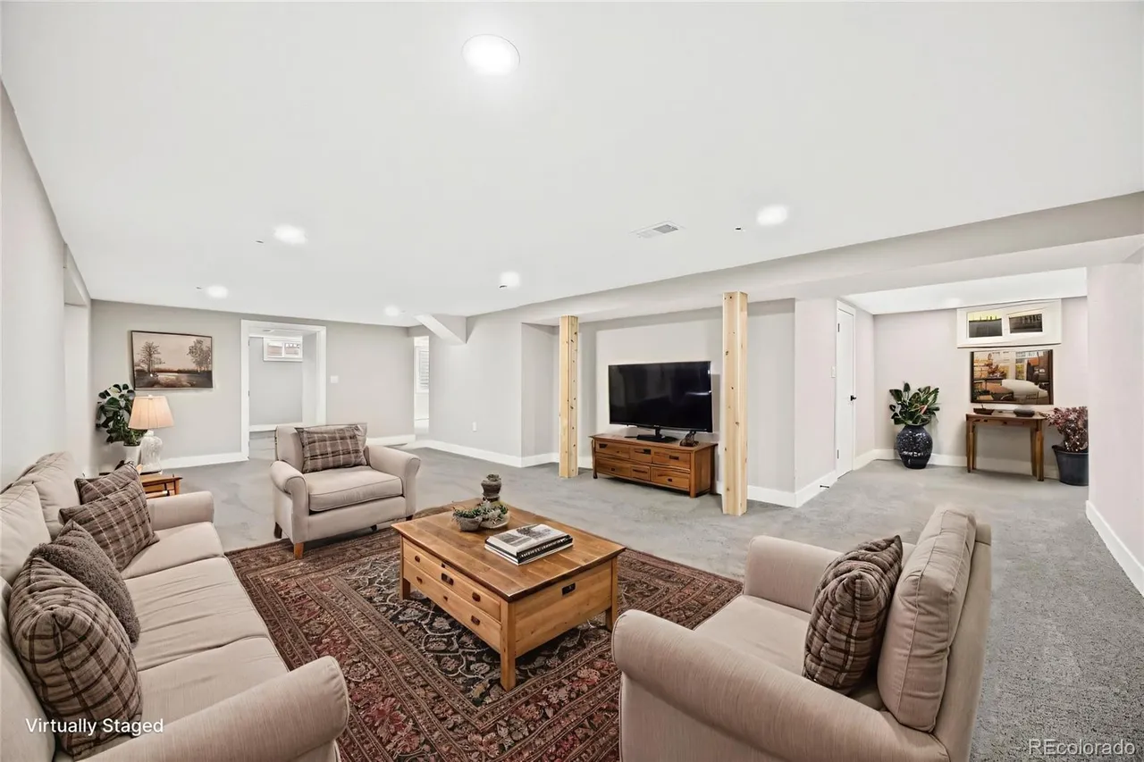 Finished basement living room with comfortable seating